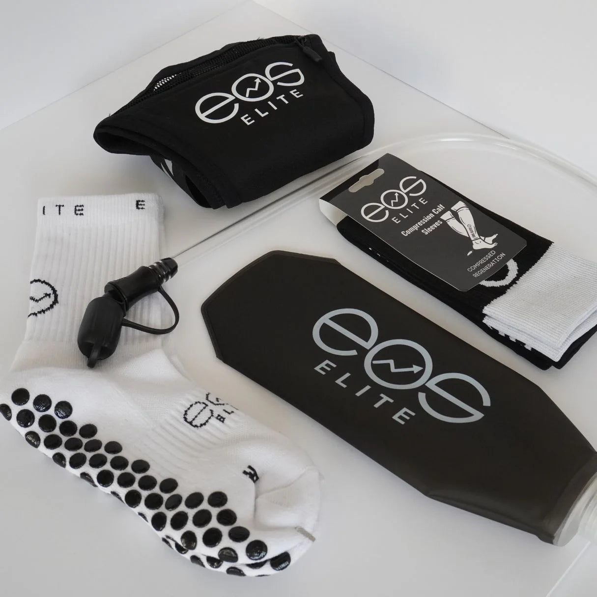 The Eos Elite Marathon Essentials bundle includes the Eos Elite Running Vest in black, silicon water bladded, Eos 1 Ultrasoft grip socks and Eos Elite Compression Calf Sleeves.