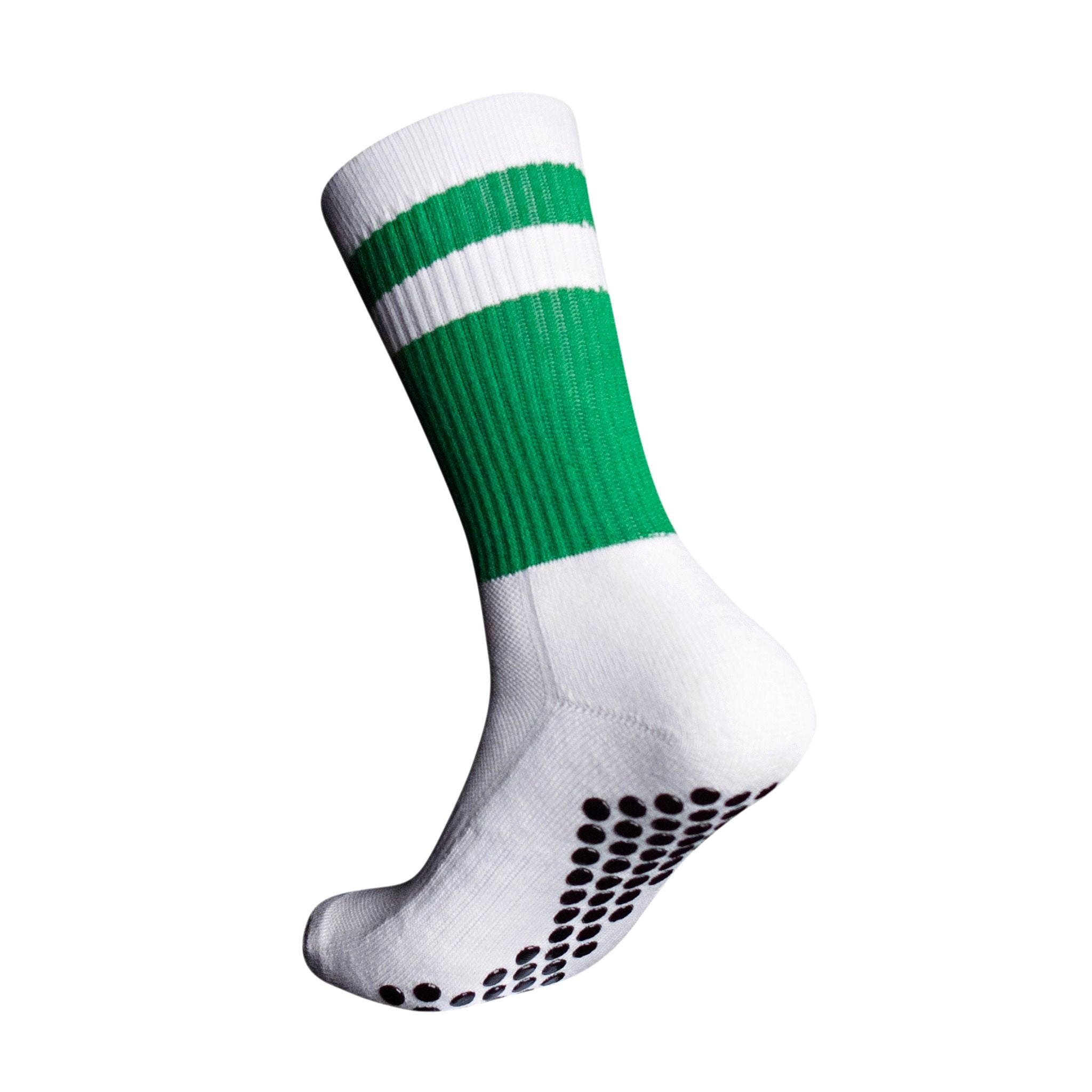 A side profile of an Eos Elite Ultrasoft grip sock in white and green with white stripe clearly shows the elasticated, breathable material and silicon grip pads on the base of the sock.