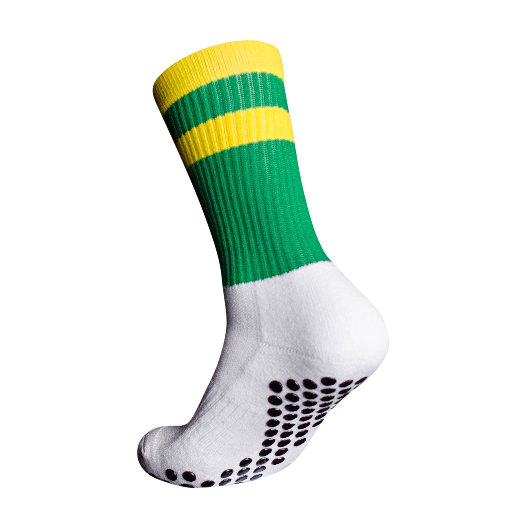 A side profile of an Eos Elite Ultrasoft grip sock in white and green with yellow stripe clearly shows the elasticated, breathable material and silicon grip pads on the base of the sock.