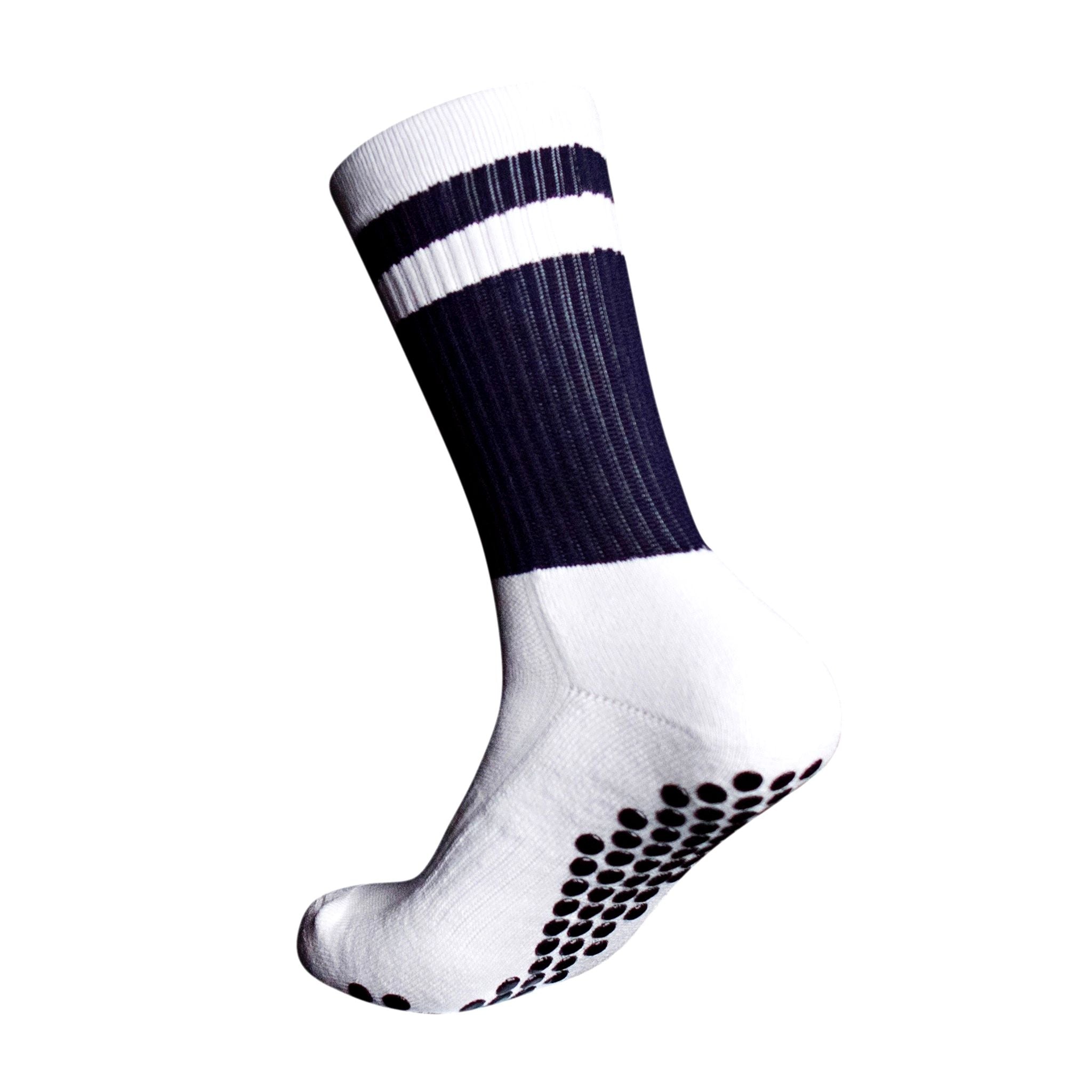 A side profile of an Eos Elite Ultrasoft grip sock in white and navy with white stripe clearly shows the elasticated, breathable material and silicon grip pads on the base of the sock.